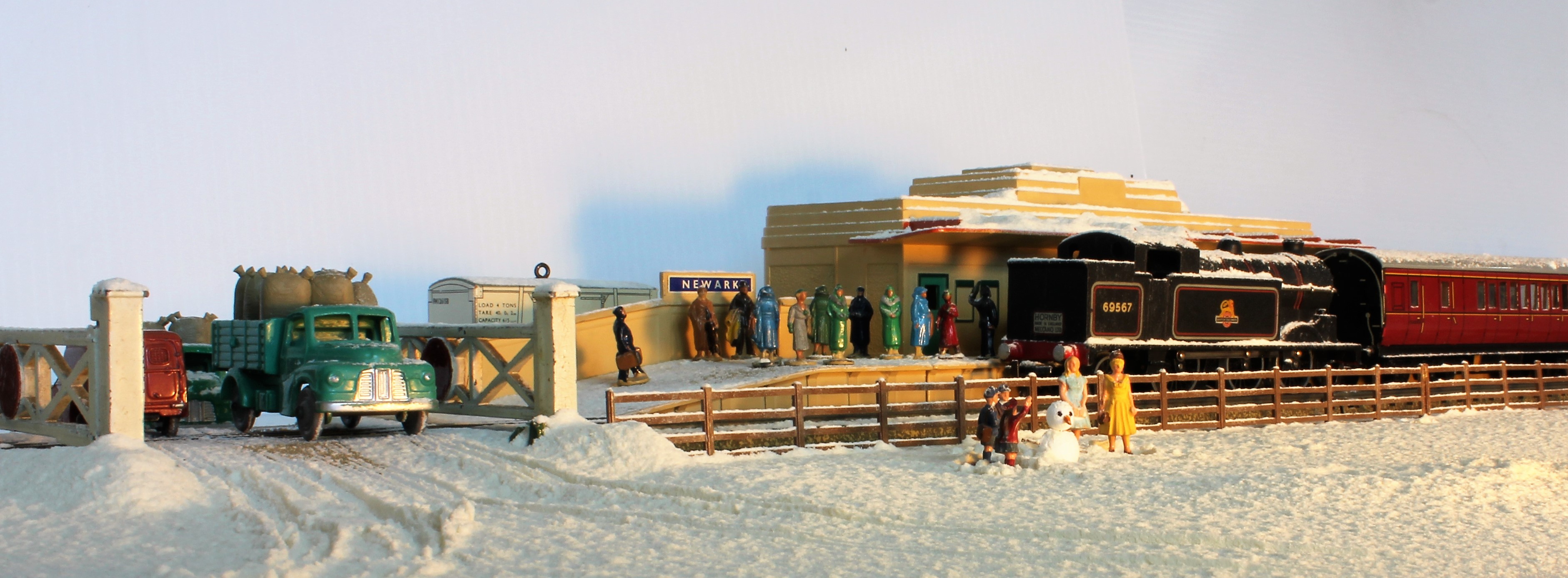 A snowy christmas scene with a Dublo train